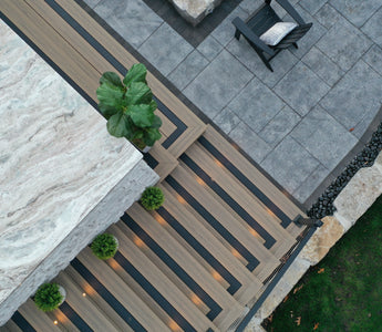 Sky view of an outdoor living space with stairs featuring Voyage Decking in Costa with Picture Frame Board in Dark Slate