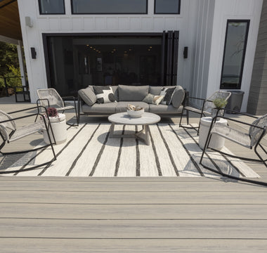 Voyage Decking in Tundra with furniture and outdoor rug