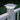 Solar-powered outdoor light fixture on a white railing with greenery in the background #color_white