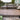Deck Off Back House with Steps Made of Deckorators Voyage Decking in Mesa and Contemporary Rail in Weathered Brown #color_weathered-brown
