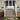 Deck steps flanked by post with cast stone postcovers and solar postcover caps #color_solar-woodland-gray