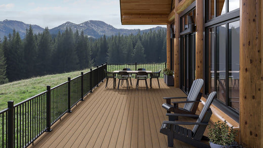 Log cabin with deck off back made of Deckorators Altitude Decking in Highland and Rapid Rail