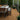 Deck in the woods made of Deckorators Meridian Decking in Sonoma and Cable Continuous Top Rail in Textured Black #color_textured-black