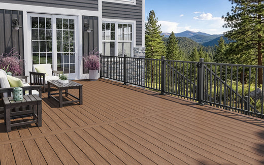 Composite deck with outdoor furniture and a scenic view of mountains and trees