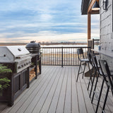 HGTV's Rock the Block House's Outdoor Grill Area Featuring Deckorators Vista Decking in Driftwood #color_driftwood