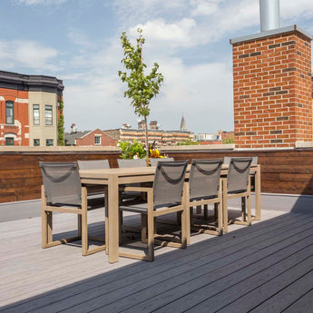 Rooftop Deck with Table and Chairs Made of Vault Decking in Dusk #color_dusk
