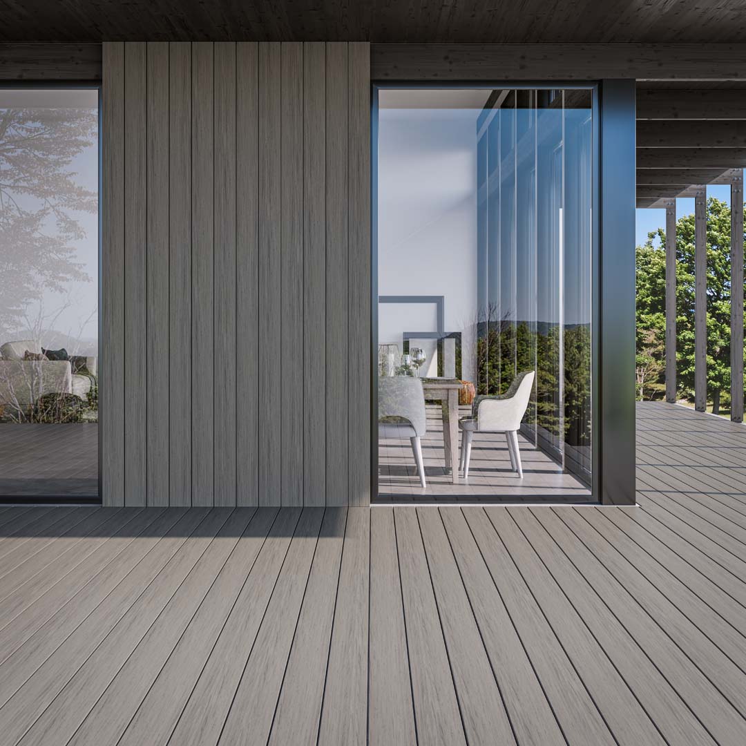 Modern House with Glass Windows Surrounded by Deckorators Voyage Decking and Cladding in Sierra Deckorators Voyage Decking in Sierra with Contemporary Cable Rail in Textured Black #color_sierra