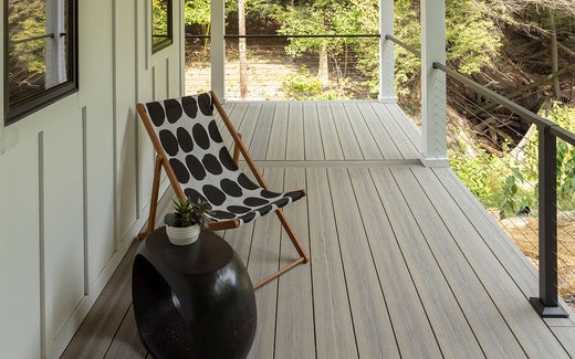 Side Porch with Deckorators Voyage Decking in Tundra and Contemporary Cable Rail