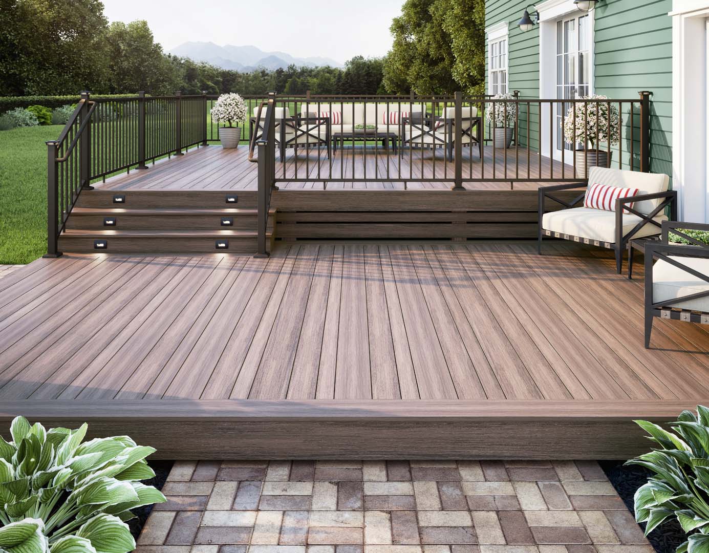 Deck Off Back House with Steps Made of Deckorators Voyage Decking in Mesa and Contemporary Rail in Weathered Brown #color_weathered-brown