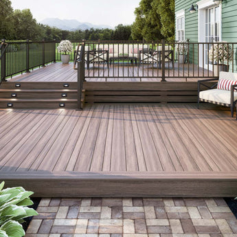 Deck Off Back House with Steps Made of Deckorators Voyage Decking in Mesa and Contemporary Rail in Weathered Brown #color_weathered-brown