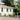 White stucco house with Deckorators Contemporary Cable Rail in Textured White #color_textured-white