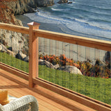 Deckoratotrs Victoria High Point Post Caps in Copper on railing overlooking seacoast #color_copper